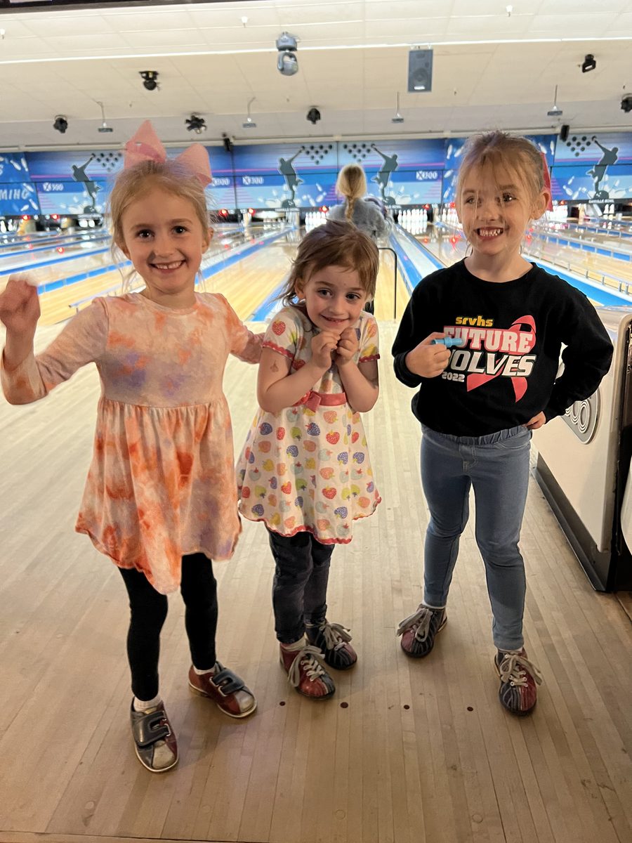 Kids smiling at the bowling event