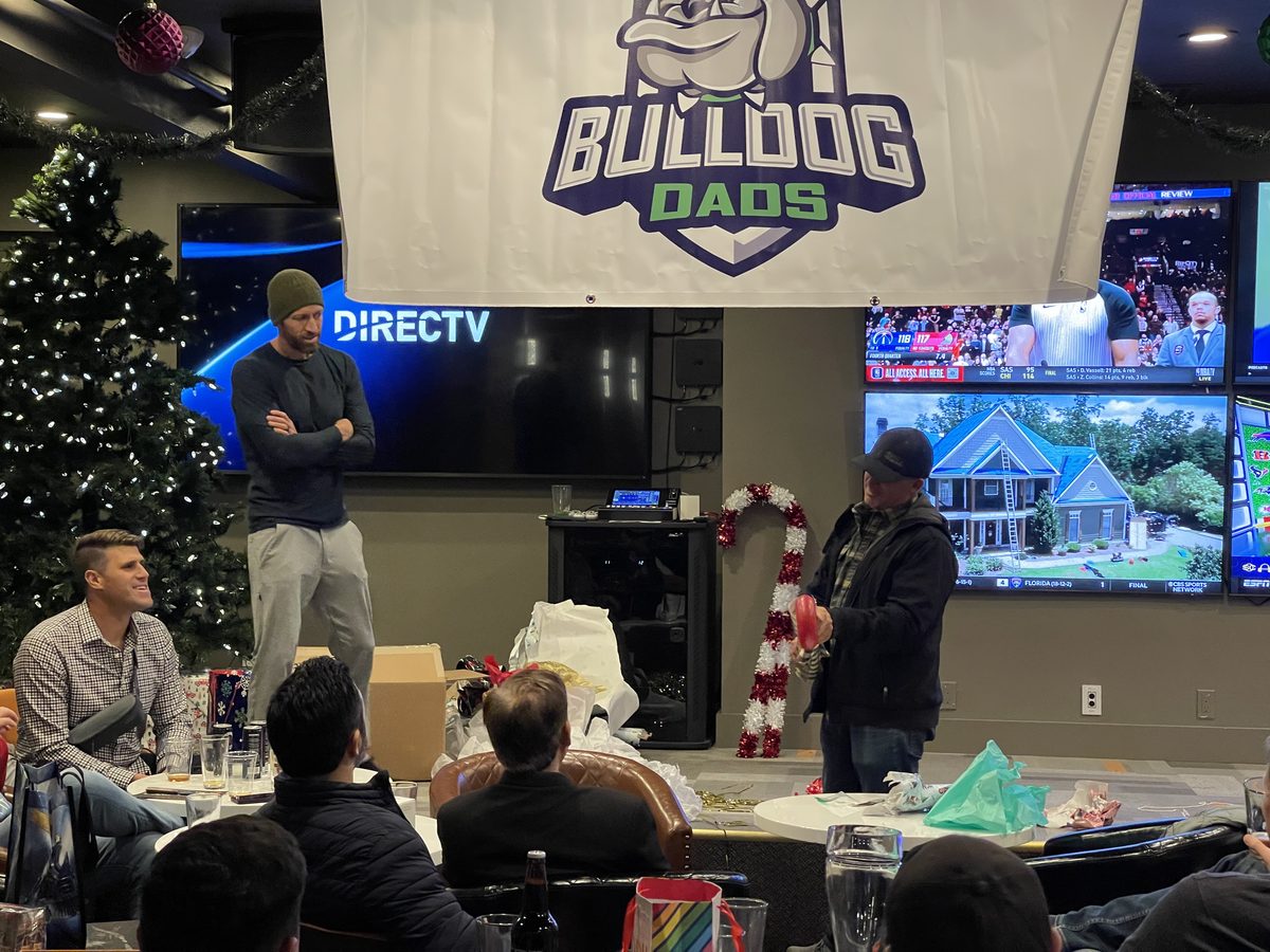 Dad presenting at a Bulldog Dads watch party event