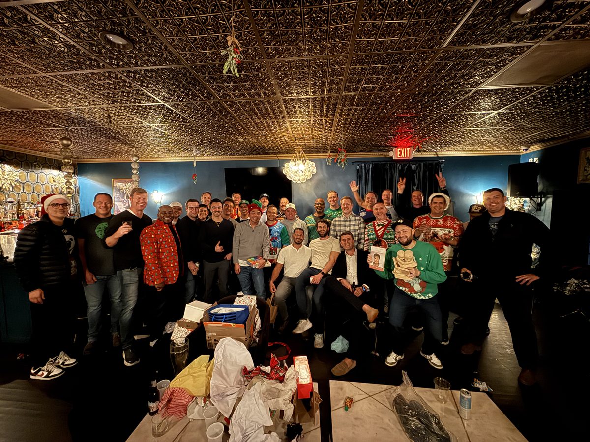 Group photo at the Bulldog Dads ugly sweater holiday party