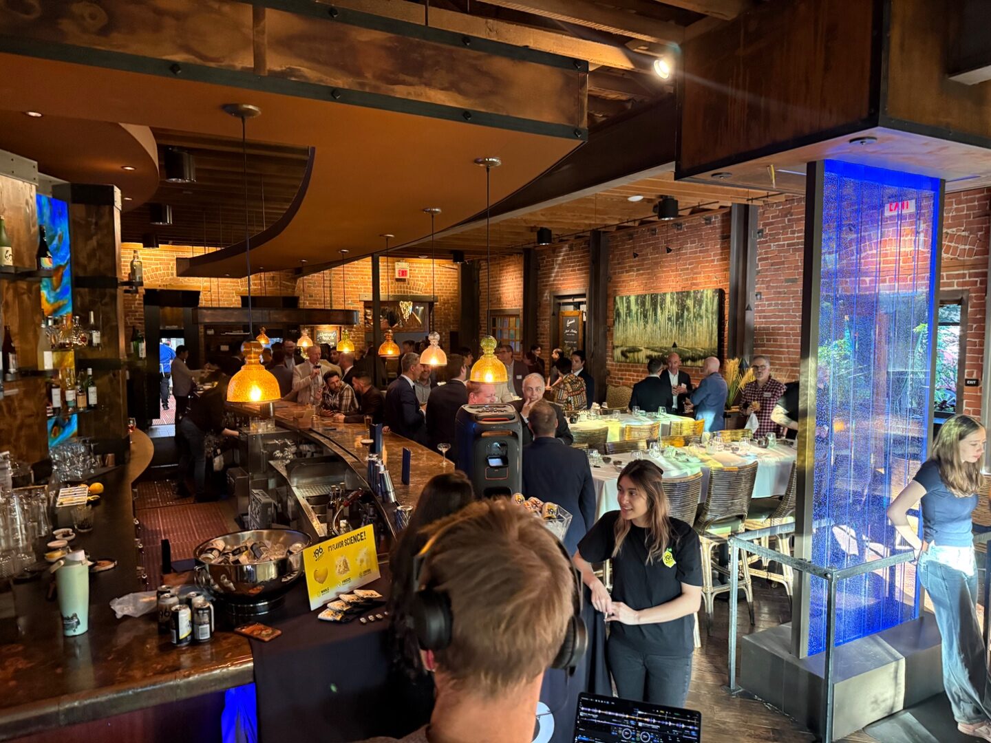 Wide shot of the lounge and bar during the late-night TLEg 2 afterparty