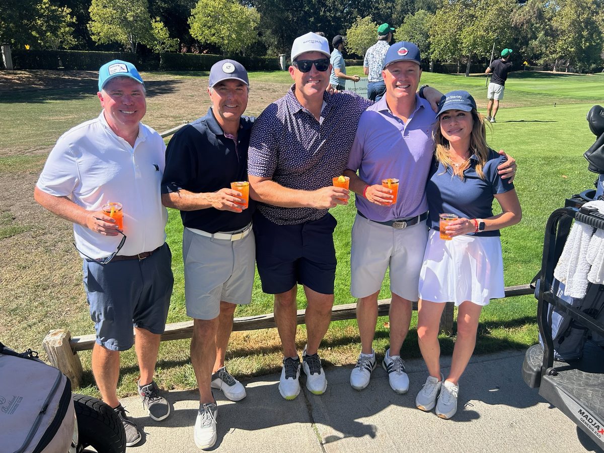 Group of friends enjoying drinks after the round
