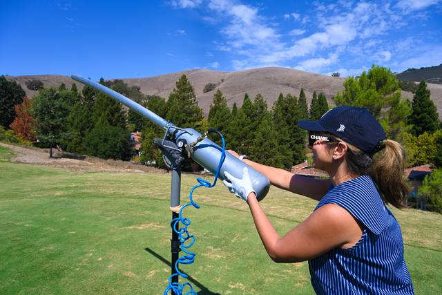 Golfer firing the ball cannon on the course, 2026 SIS Golf Classic